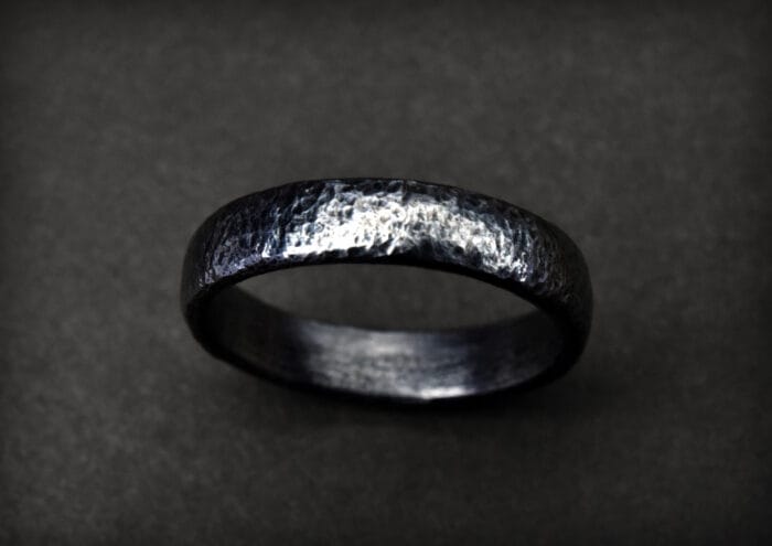 0649fc_ad362adee05243f19d6e3c484a791563mv2.jpg Titaninis žiedas - Image 1